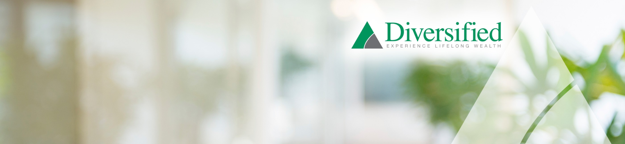 A blurred office background with green plants and the Diversified logo in the upper right corner, featuring a green triangle and the tagline 